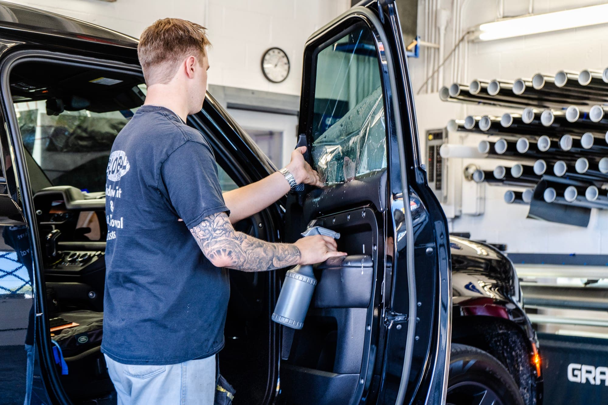 Carefully installing film on a truck window